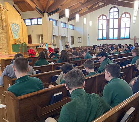 Students in Pews at St. Helen Experiencing Inclusivity