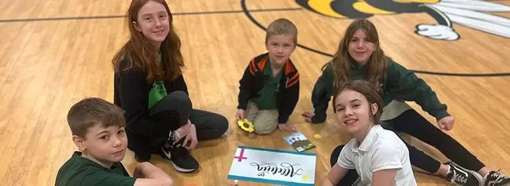 St. Helen School Kids on Gym Floor for Cleveland Diocese Fundraising