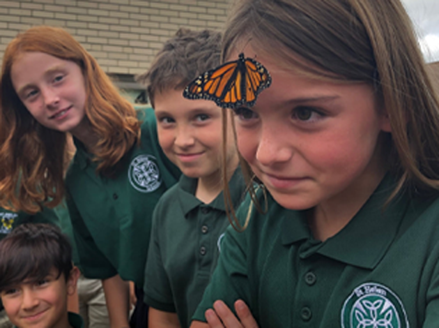St. Helen School Students With Monarch Butterfly on Forehead